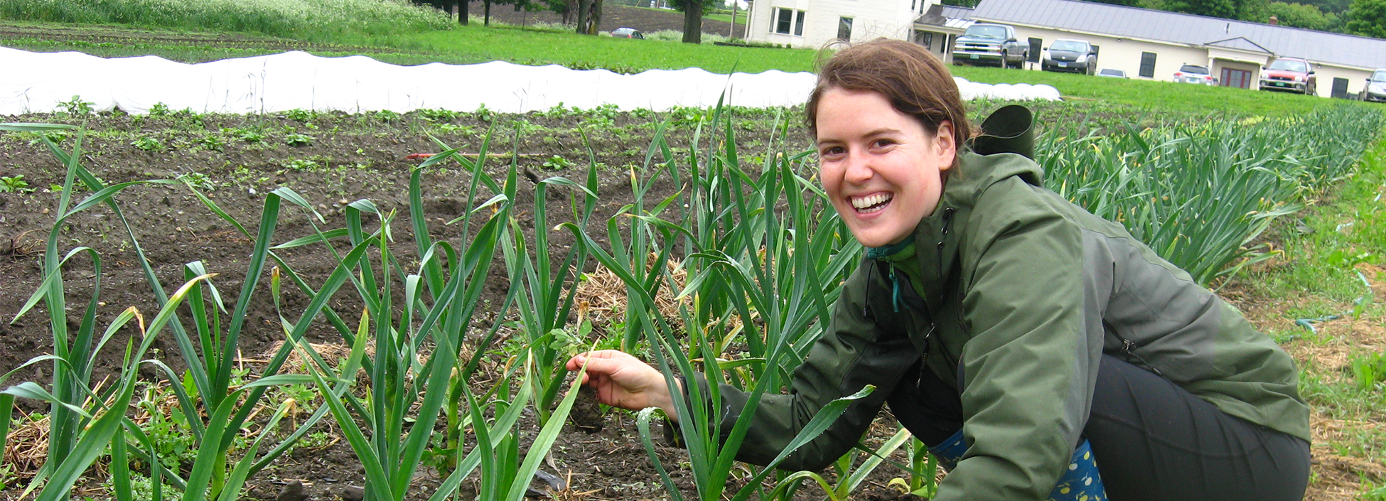 Student gardening by Langevin, Randolph Center campus