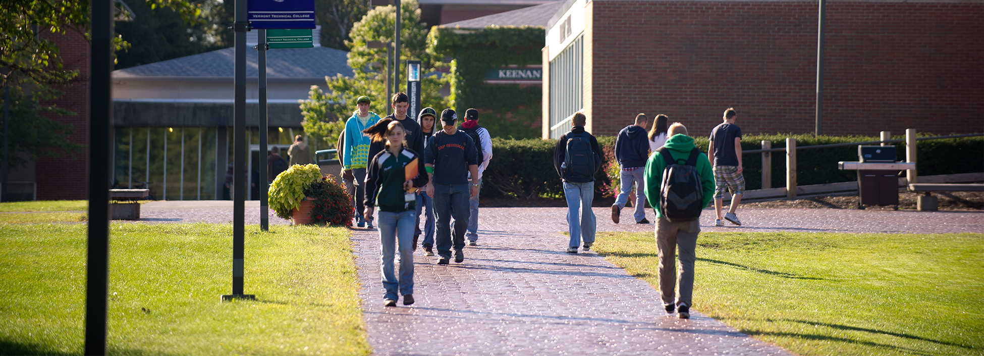 Students at the Randolph Center Campus walk to class past the Morey Dining Hall and Dormitory