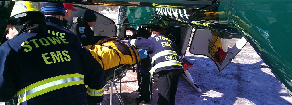 Paramedics load a helicopter with hurt patient