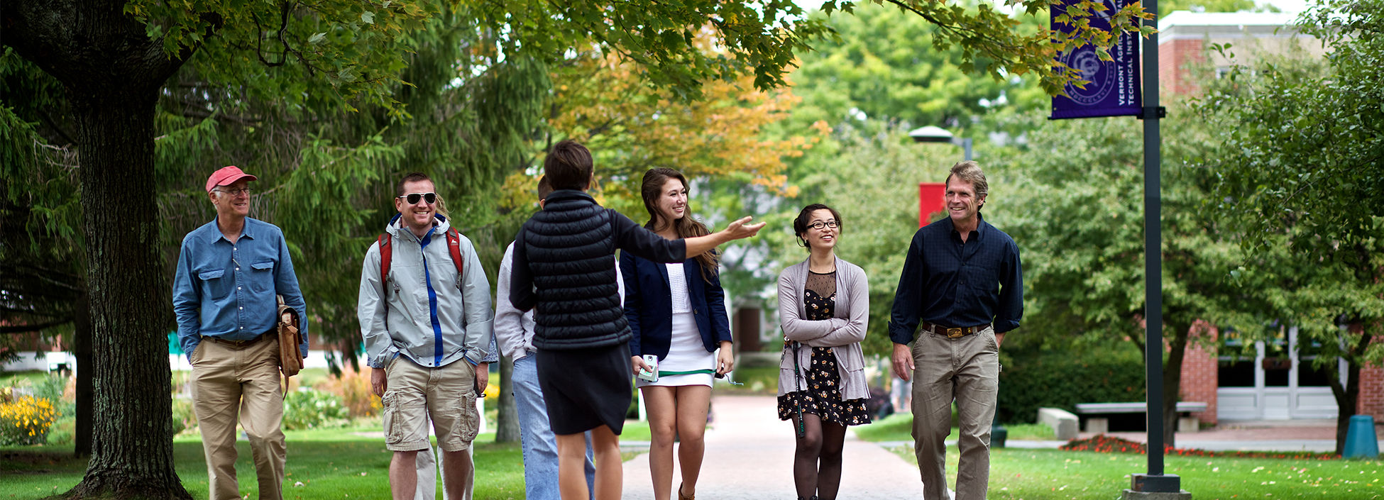 A Vermont Tech tour guide showing students around the Randolph Center Campus