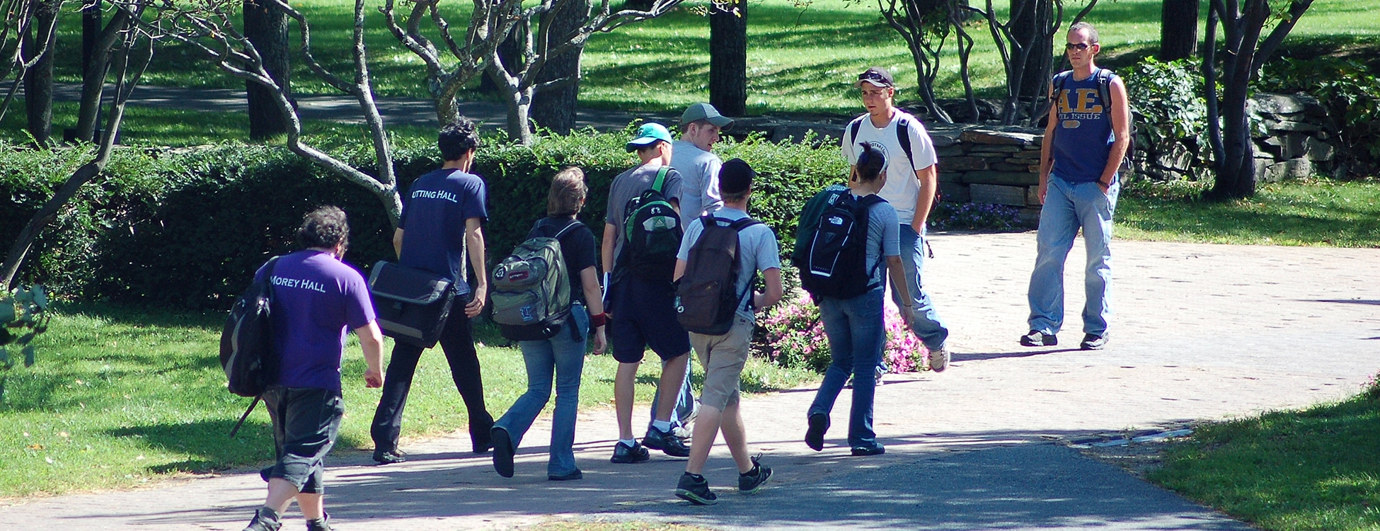 Students walk up the walkway in the early fall on the Randolph Center campus