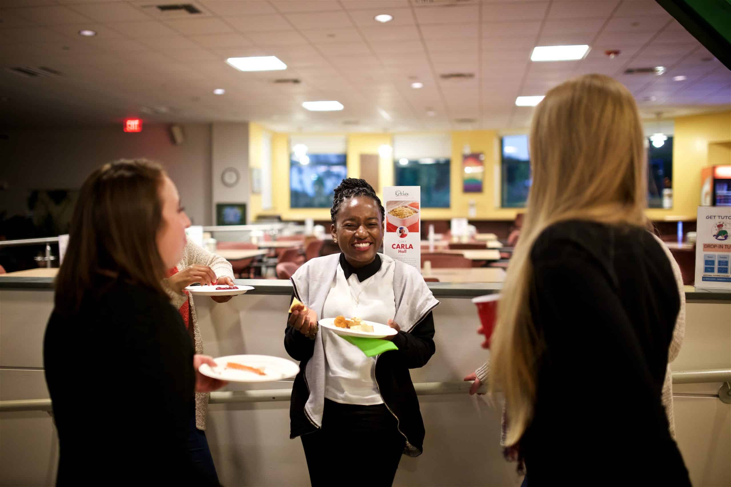 Current students conversing and enjoying snacks.