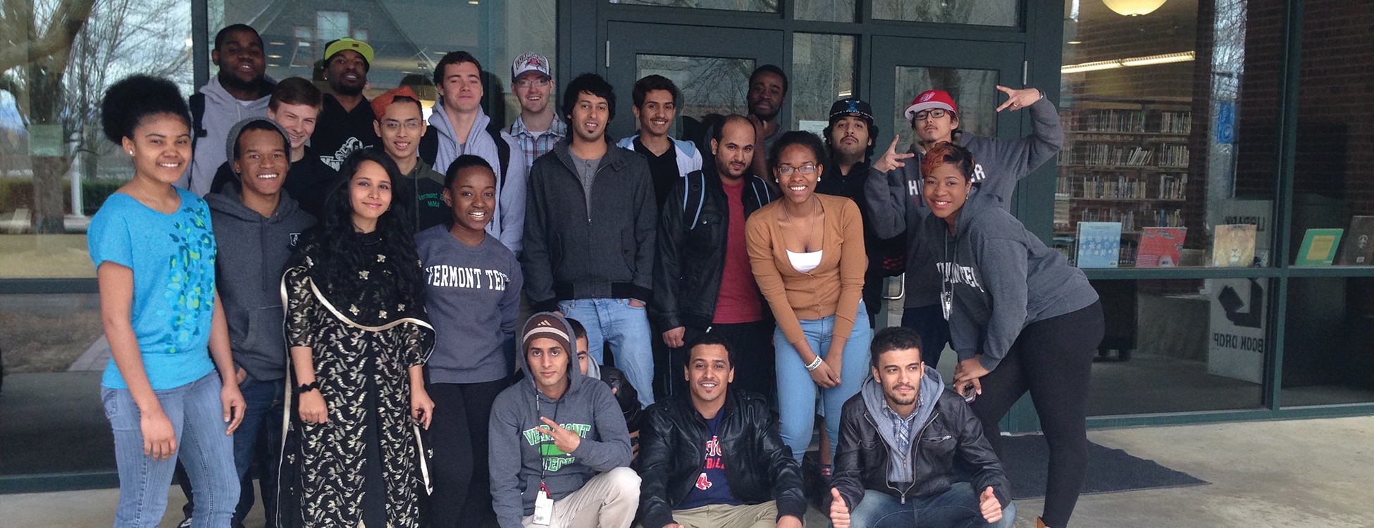 Vermont Tech's Multicultural Club members pose outside of the Hartness Library, student club, Randolph Center campus