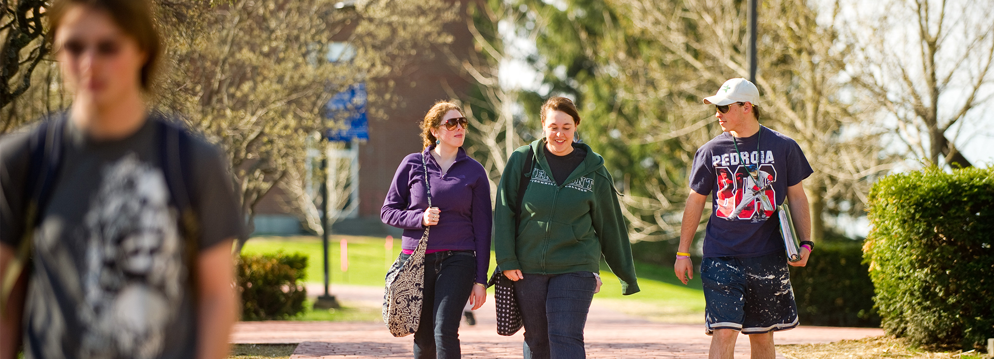 Female students walk to spring semester classes on the Randolph Center Campus