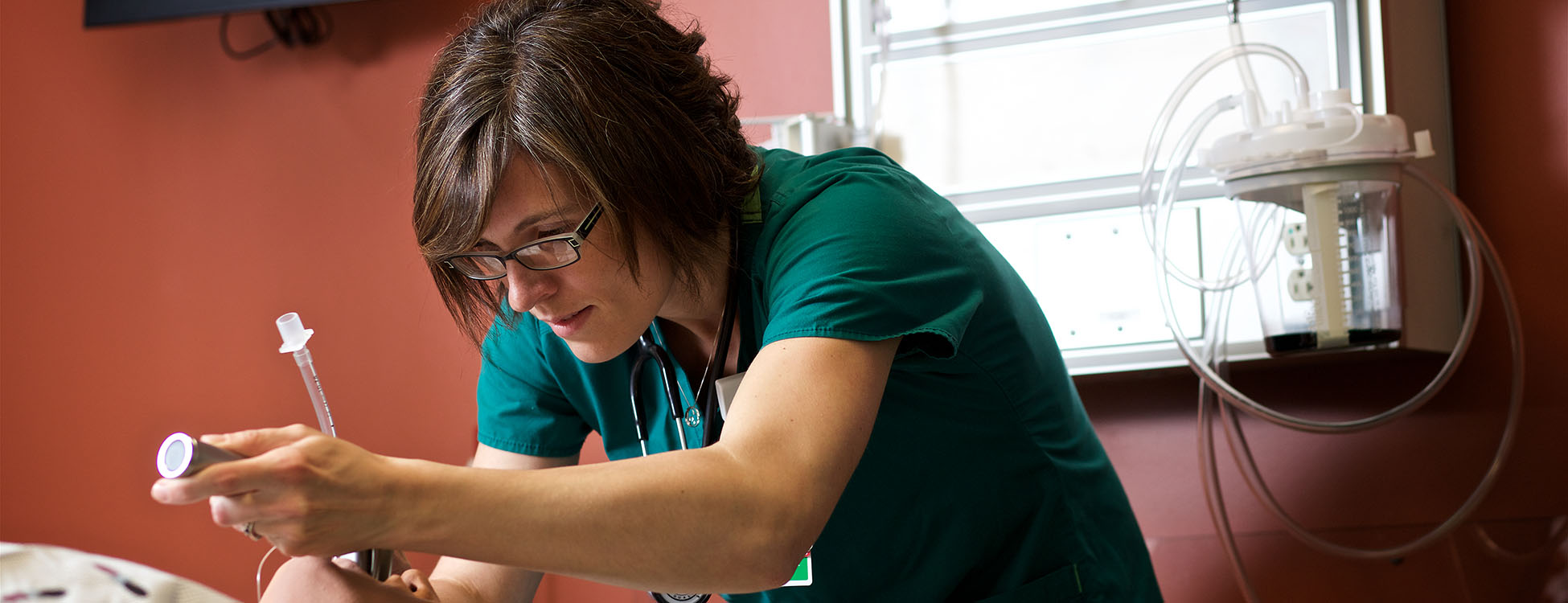 Kate Morrison, student, practices on a simulation man, respiratory therapy, healthcare, lab, hands on