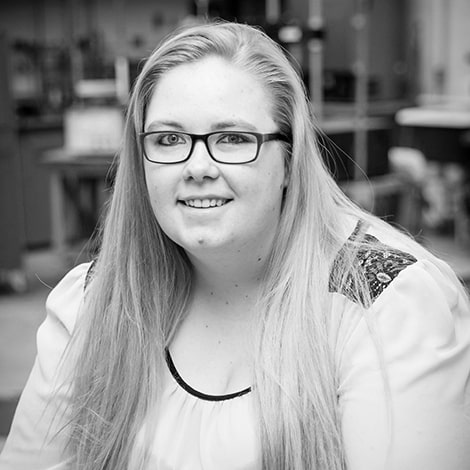 Katrina Hagan, girl with glasses, smiling in the civil engineering lab, Randolph Center campus