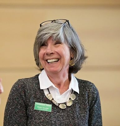 Robin Goodall, staff member, smiles while at a conference