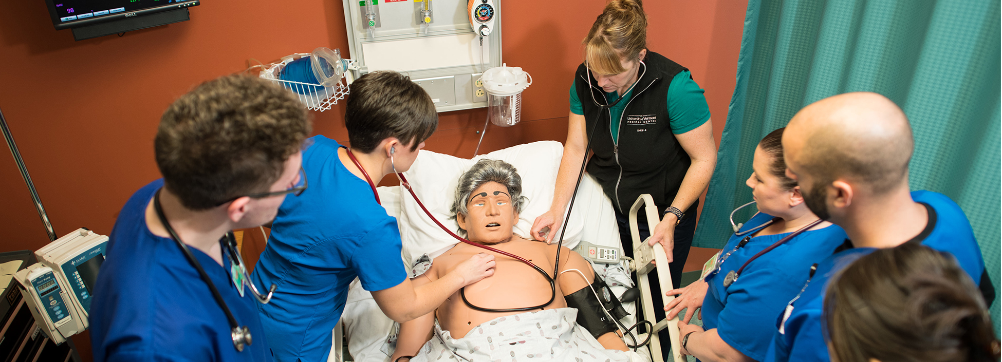 Nursing students working in the simulation lab on the Williston campus with nursing faculty