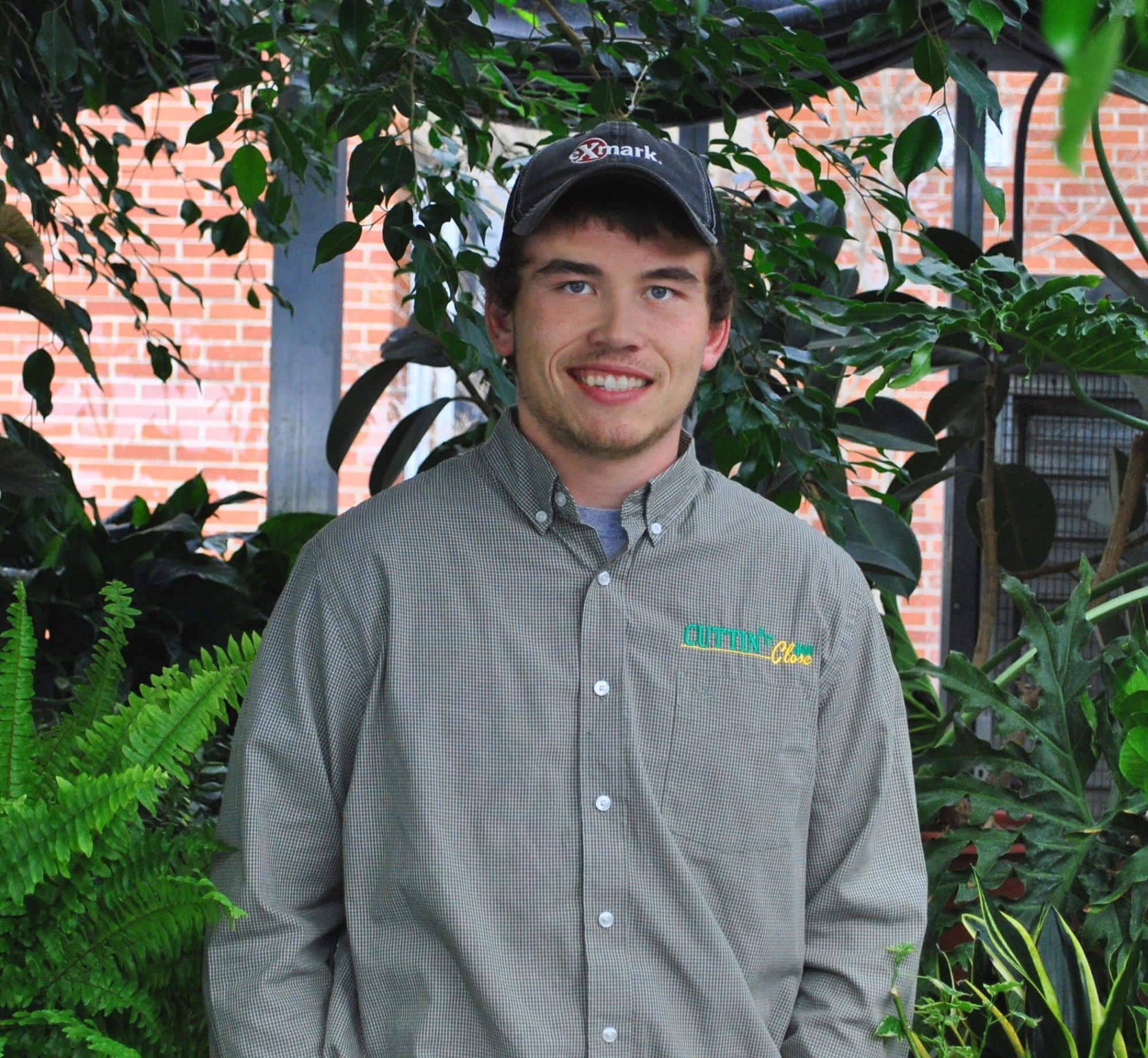 Jack Beauparland, student, stands in the greenhouse on the Randolph Center campus