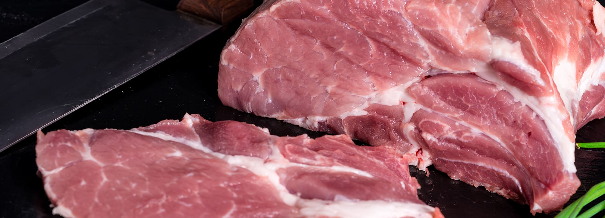 Meat is cut and ready to be portioned into serving sizes, meat cutting, butchering