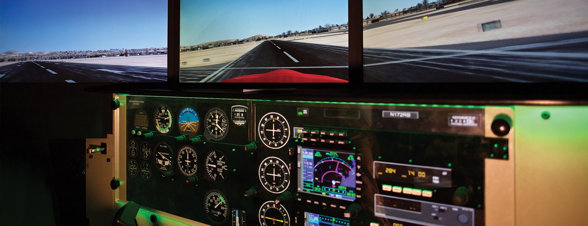 Professional Pilot flight simulator controls with screen showing a landing, Williston campus