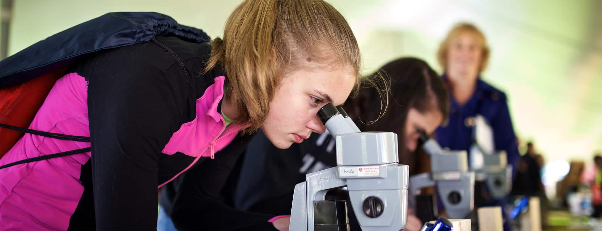 female student, STEM, microscope, leadership