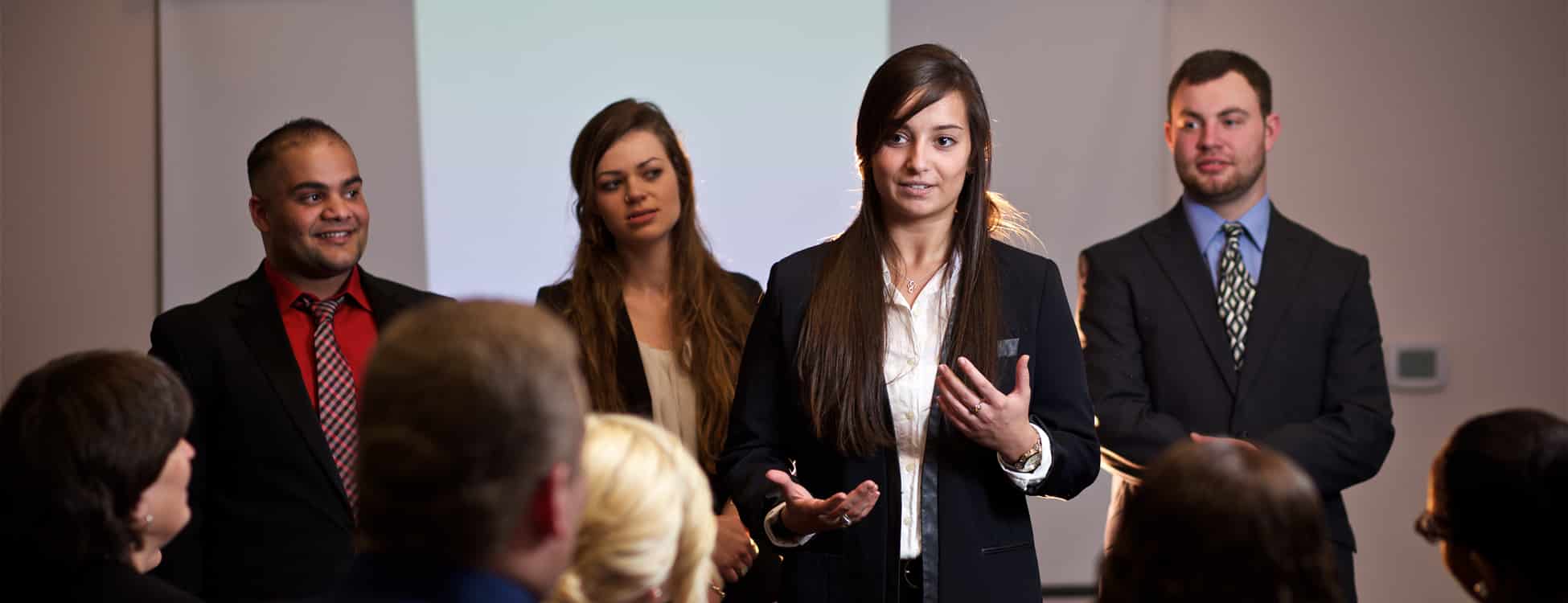 Business management students during their senior presentation, oral presentation, entrepreneurship, professional