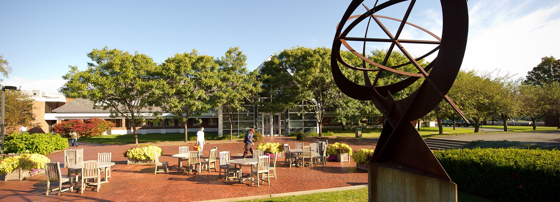 Randolph Center campus, plaza, patio, sculpture, sun, tables, relaxing