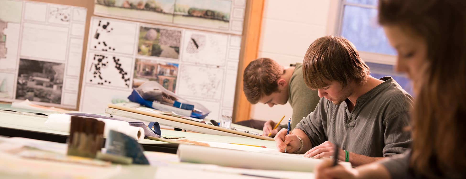 Students working in the landscape lab, drawing, drafting tables