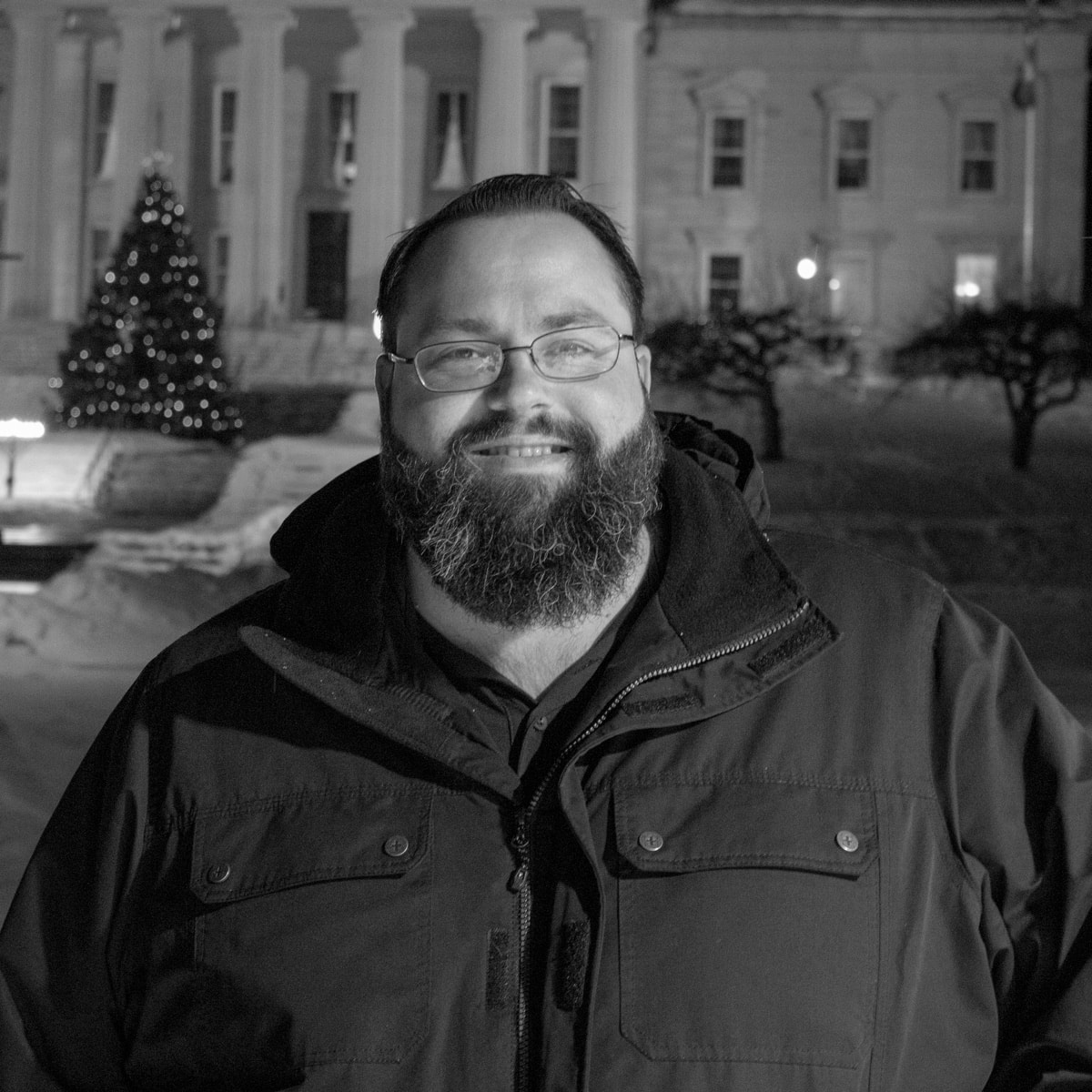 Male student, Chris Mooney, smiling, outside