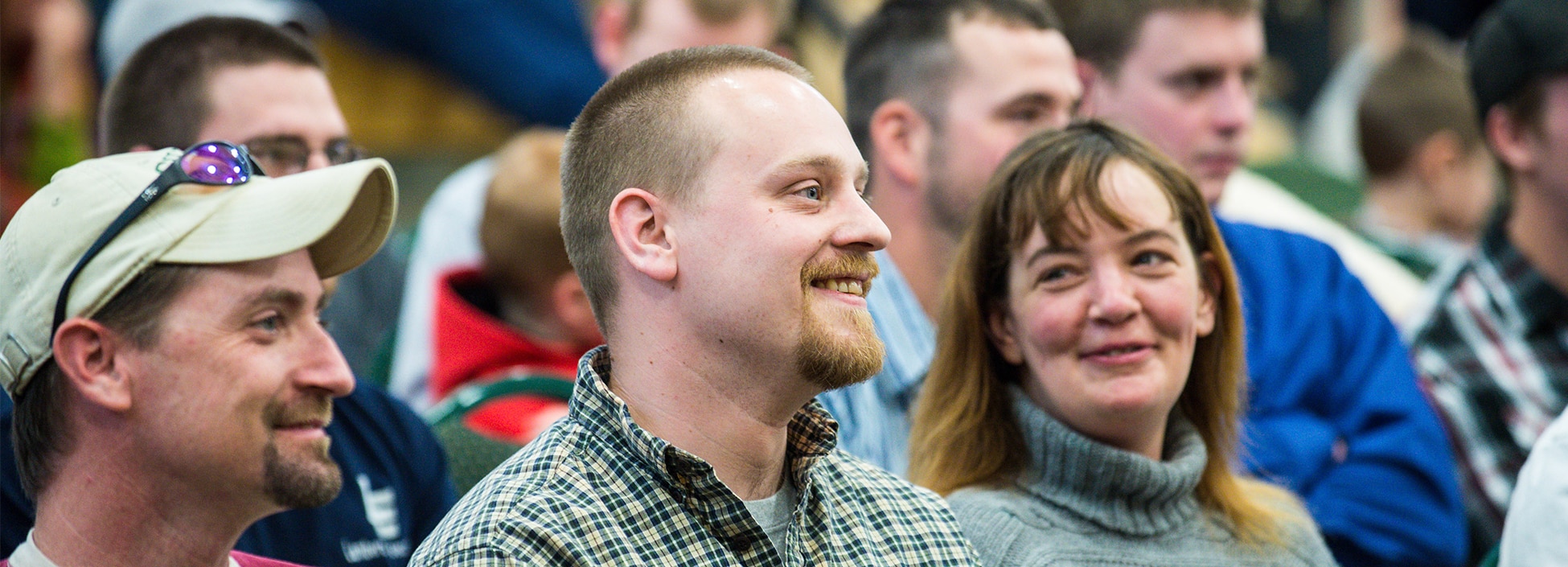 male smiles in crowd