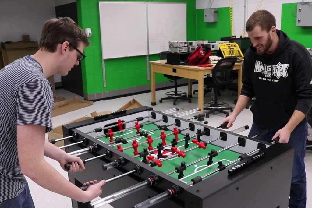 male students build foosball table, senior project, lab