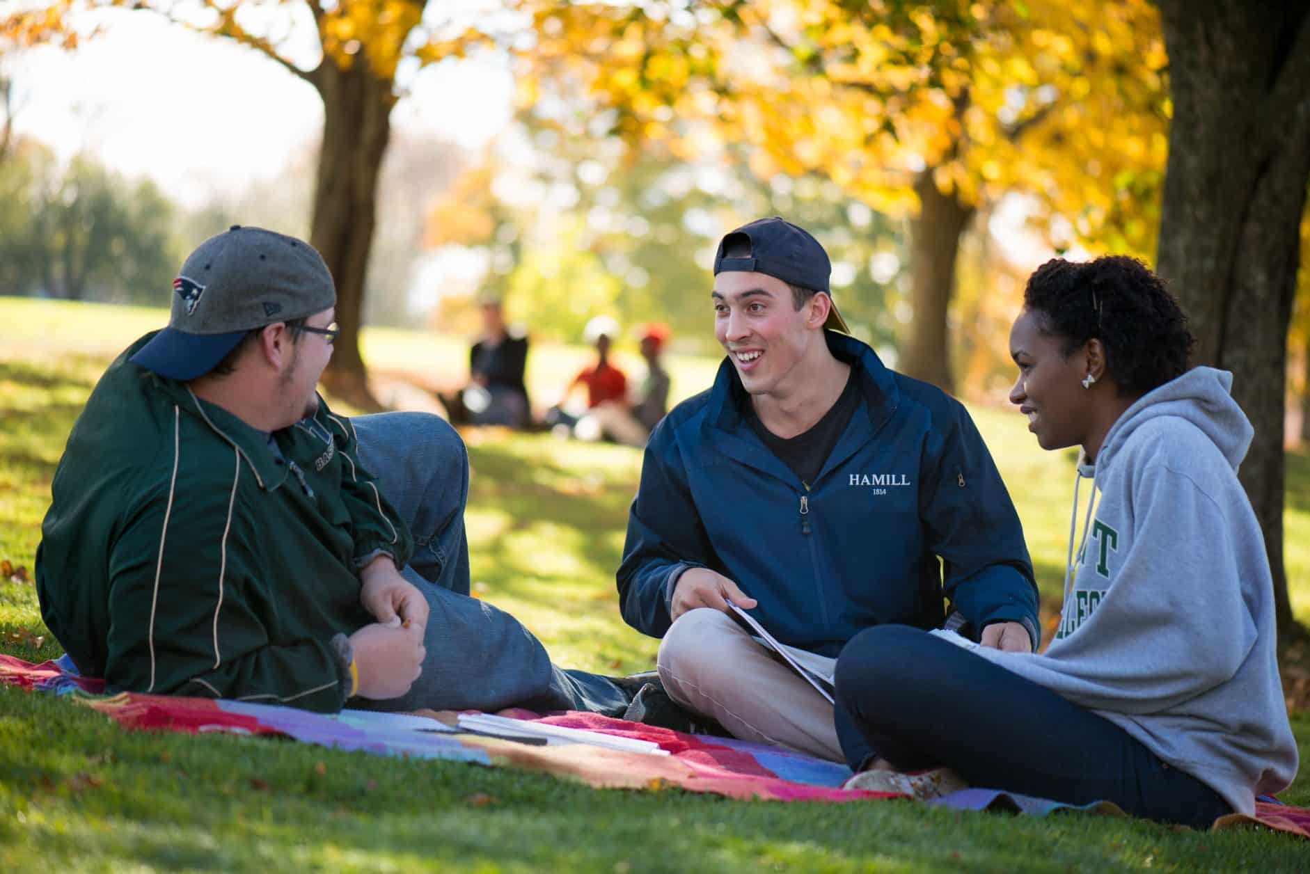 Female students, male students, diversity, autumn in Vermont, trees, relaxing, chatting