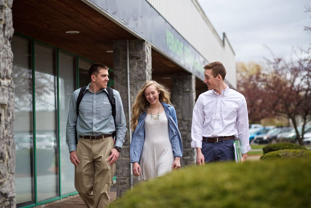 Williston campus, female student, male students, talking, walking, smiling, conversation