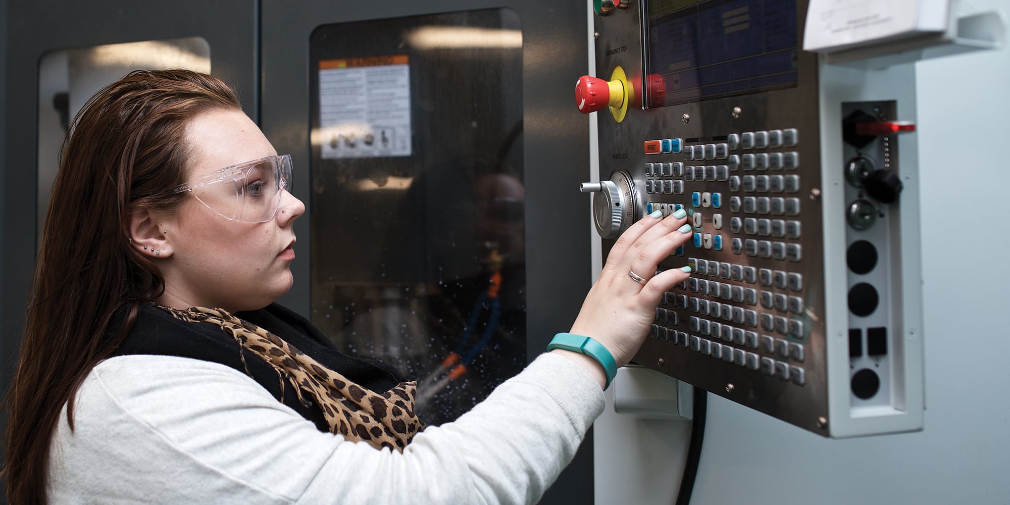 Female student, Emma, mechanical engineering technology, HAAS machinery, lab