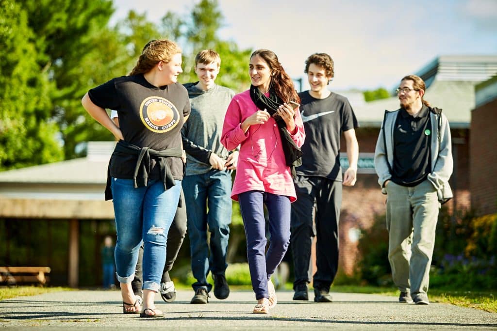 female students, male students, walking, sun, smiling, happy