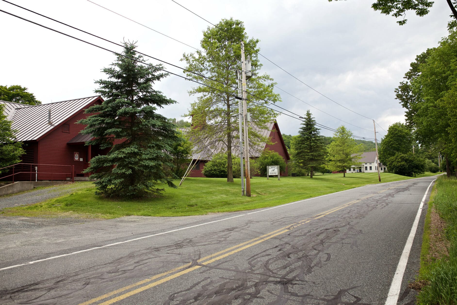 A roadside photo of a property in Norwich, VT temporarily used for agriculture education until student satisfaction led to the return to the Randolph Center campus farm operations exclusively.